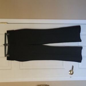 Black pleated Dress pants. Elastic waistband. Medium. Flare.